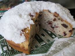 Boston Bun spiced fruit filled mashed potato dough topped with coconut icing